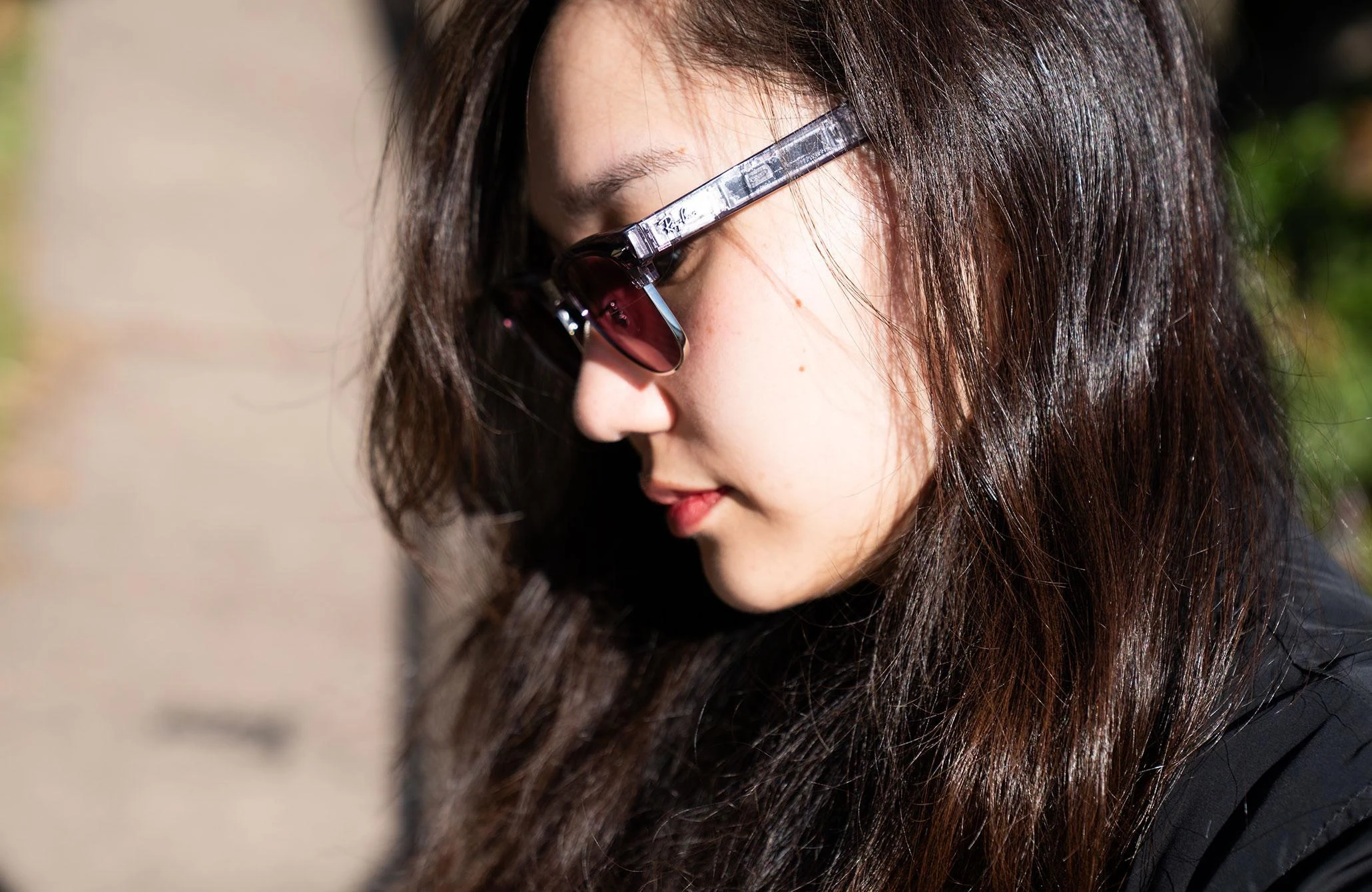 Side profile view of senior reviewer Victoria Song wearing the Ray-Ban Meta Audio glasses.