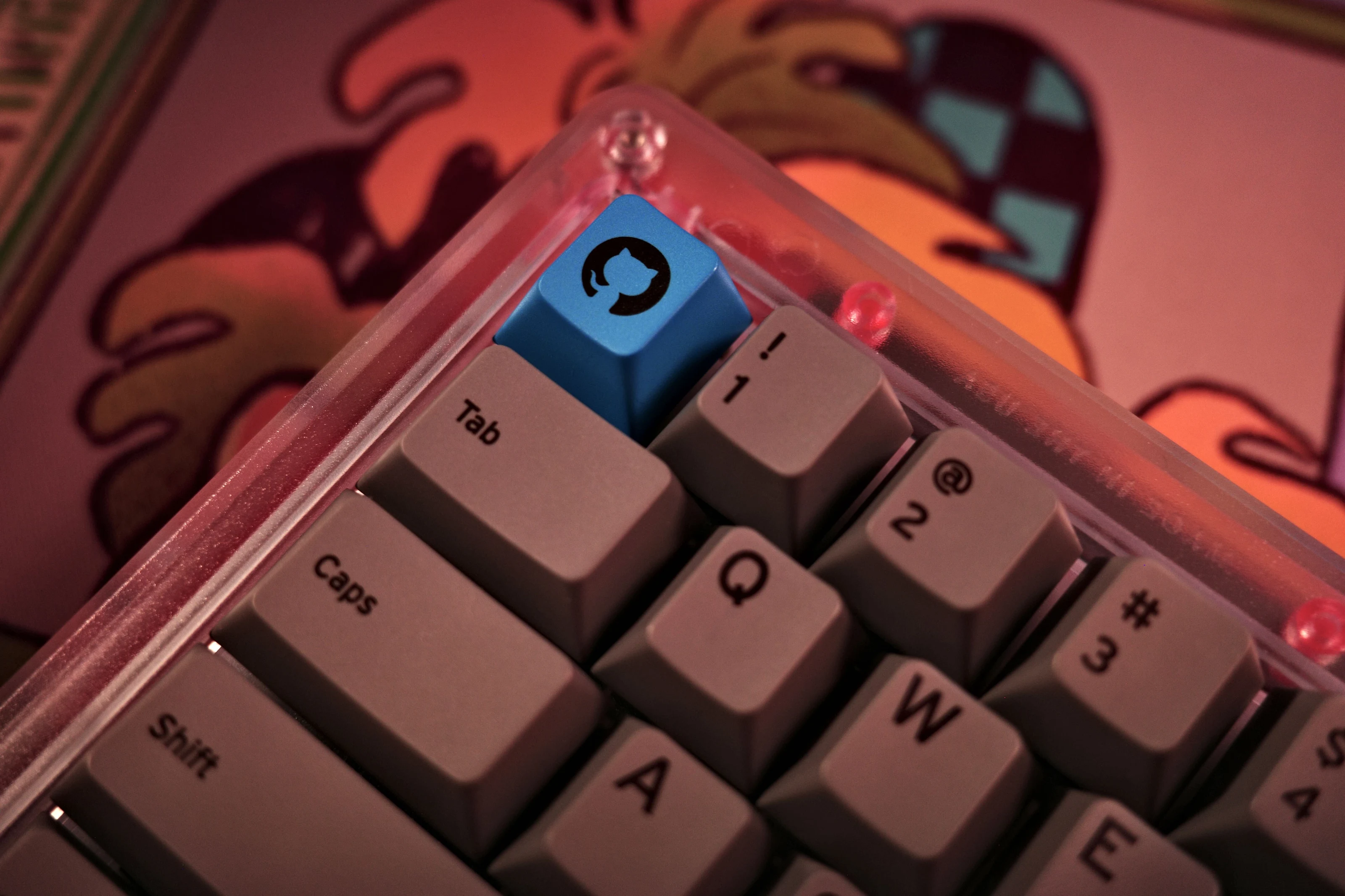 Close up of a keyboard with a GitHub logo key cap.