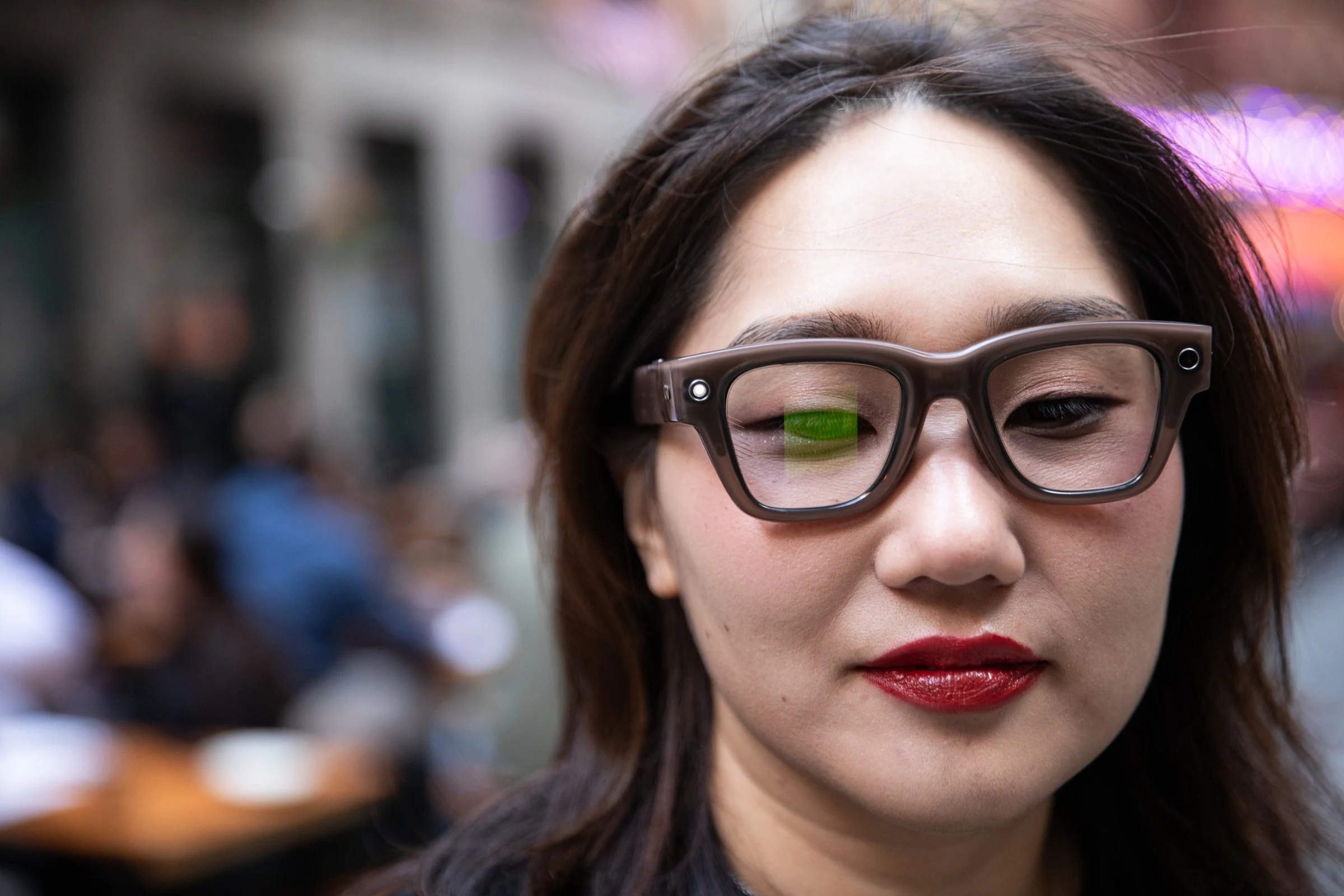 Senior reviewer Victoria Song wearing a pair of Meta Ray-Ban Display glasses with the privacy LED on.