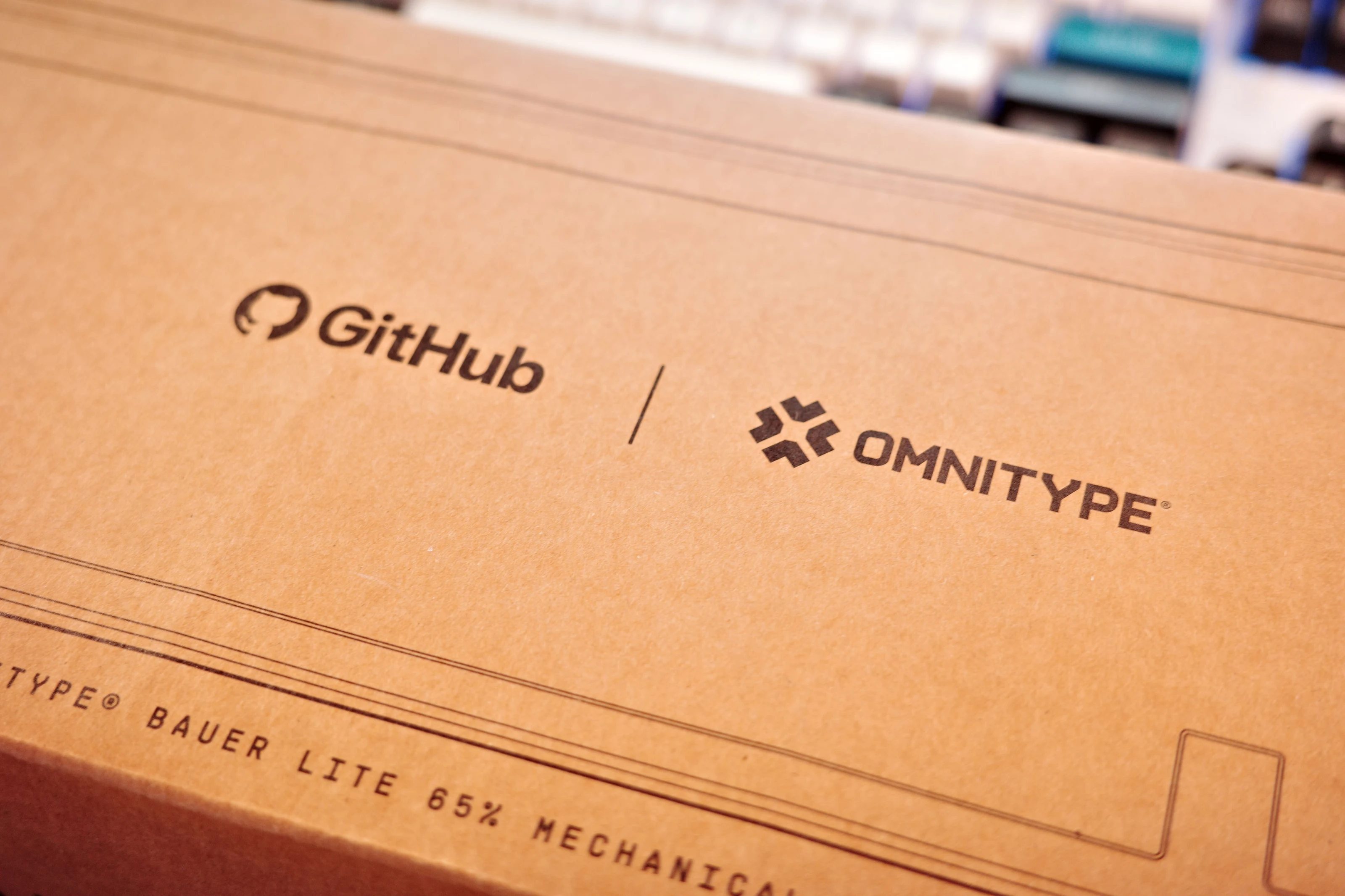 Box for the GitHub Universe keyboard. It has the GitHub logo and the OMNITYPE logo.