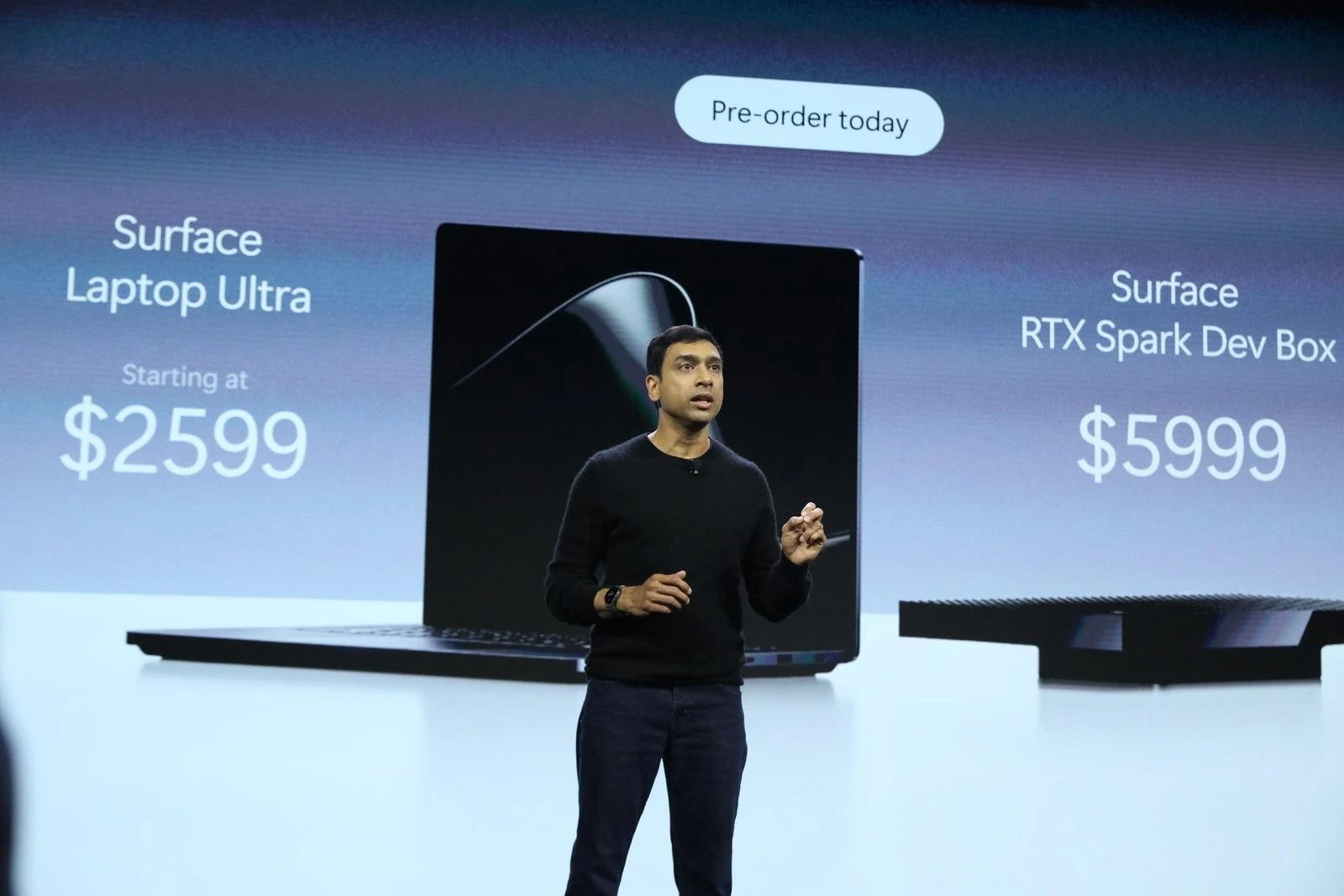 A photo of Windows and Surface chief Pavan Davuluri announcing the Surface Laptop Ultra and RTX Spark Dev Box prices.