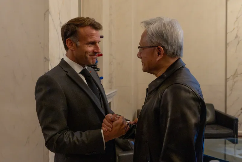 President Macron shakes hands with NVIDIA CEO Jensen Huang.