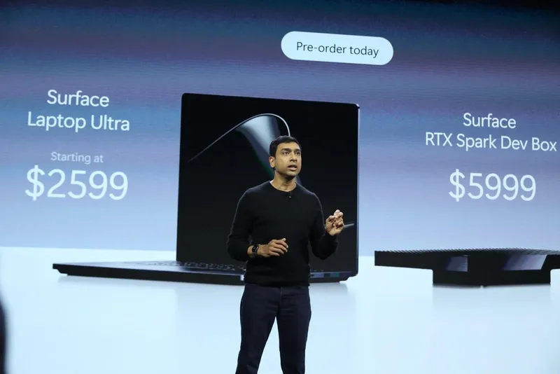 A photo of Windows and Surface chief Pavan Davuluri announcing the Surface Laptop Ultra and RTX Spark Dev Box prices.